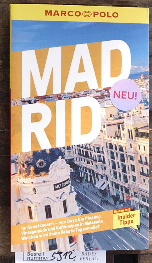 Portada de guía Marco Polo sobre Madrid en alemán con el icónico edificio Metrópolis.